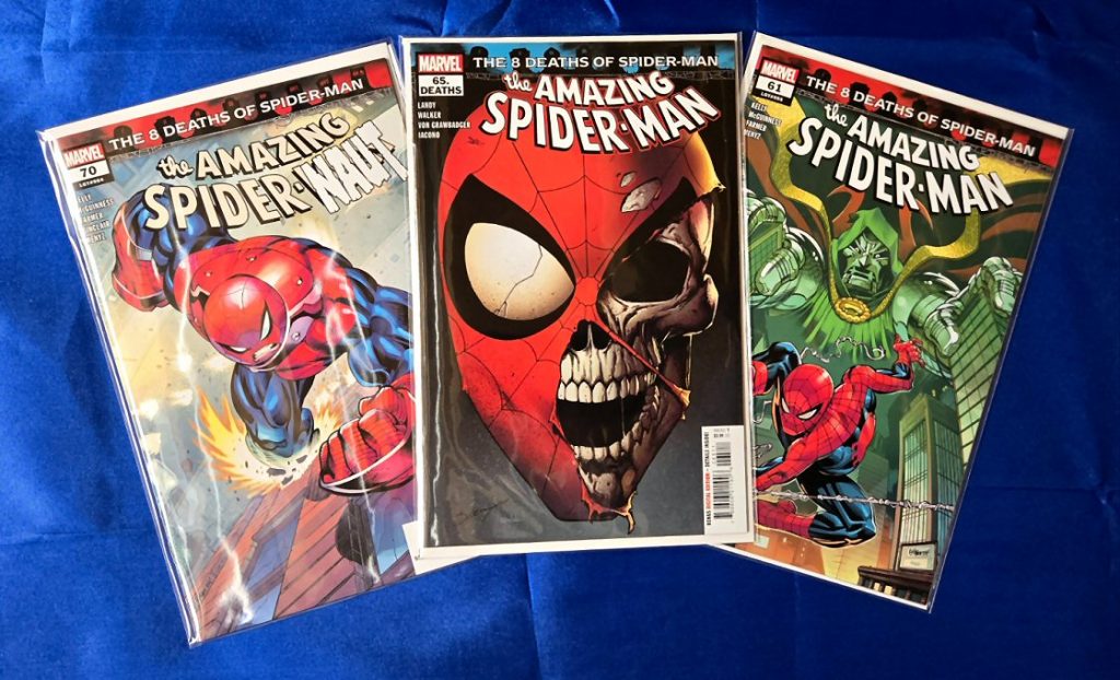 Amazing Spider-Man Vol 6 issue 61 by Joe Kelly (cover art by Ed McGuinness and Marcio Menyz), Issue 65.DEATHS by Derek Landy (cover art by Mark Bagley and Richard Isanove). Issue #70, by Joe Kelly (cover art by Ed McGuinness, Cliff Rathburn and Marcio Menyz)