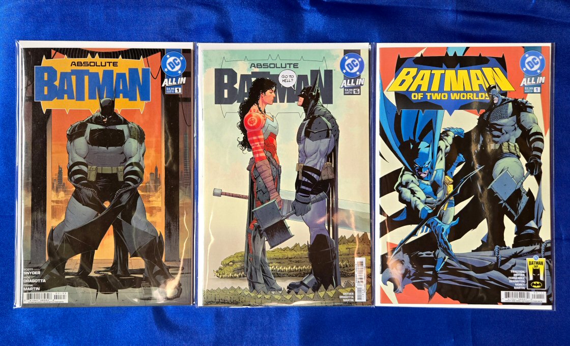 Covers of Absolute Batman Vol 1 issue #1 2024 (11th printing, Nick Dragotta), Absolute Batman Vol 1 issues #16 2026 (Nick Dragotta and Frank Martin), and Batman Day 2026: Batman of Two Worlds one-shot (Jorge Jiménez, Nick Dragotta, and Frank Martin).